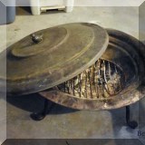 L06. Firepit with bird shaped handle on lid. 
